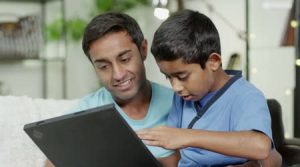 depositphotos_45205505-Father-and-son-browsing-the